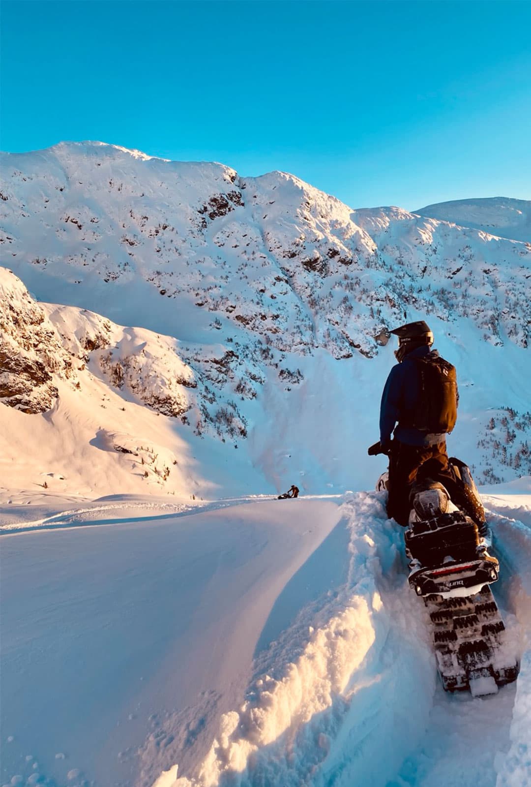 Rider working along a sunlit ridge